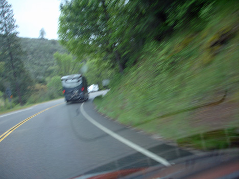 tight corners on a curvy narrow mountain road in the rain