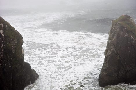 the ocean pounding the rocks