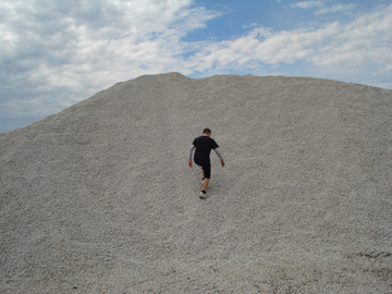 the boys decide to climb the hill of gravel